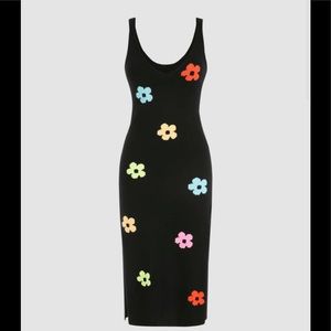 Black knit floral print dress, size small. Slit hem on both sides.